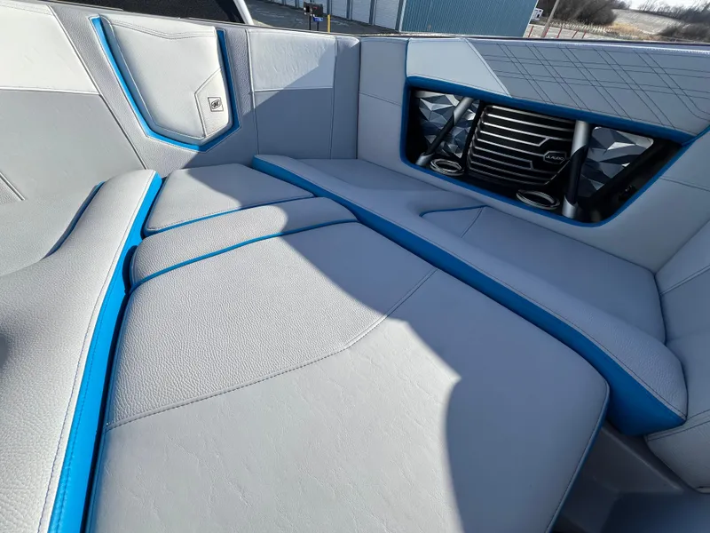 Slide: The Image of 2020 Nautique G21 boat interior with blue accents and modern design. - 28
