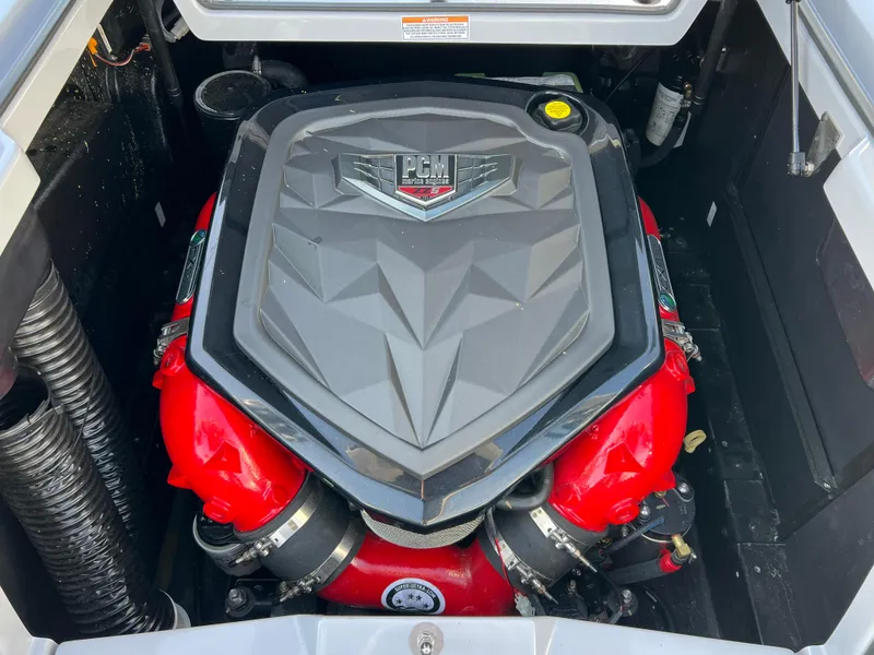 Slide: The Image of 2020 Nautique G21 engine with PCM cover, featuring red accents. - 35