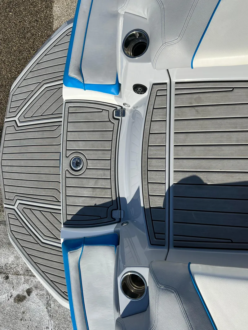 Slide: The Image of 2020 Nautique G21 boat deck with gray and blue accents. - 36
