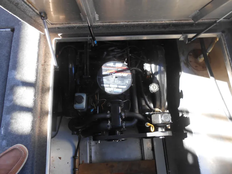 Slide: The Image of 1998 Lakeview 5516 engine compartment with visible components and wiring. - 17