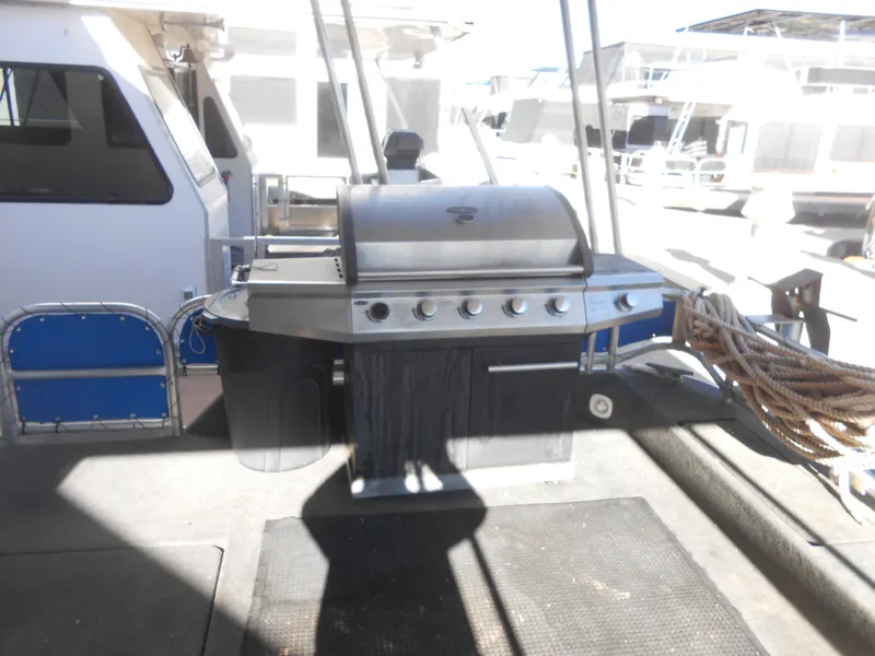 Slide: The Image of Stainless steel grill on a 1998 Lakeview 5516 houseboat deck. - 24