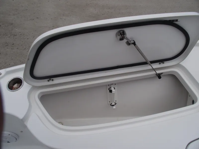 Slide: The Image of Open storage compartment on 2019 Sea Hunt BX 22 BR boat. - 10