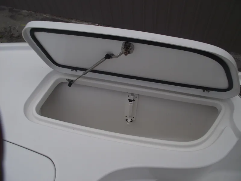 Slide: The Image of Open storage compartment on 2019 Sea Hunt BX 22 BR boat. - 12