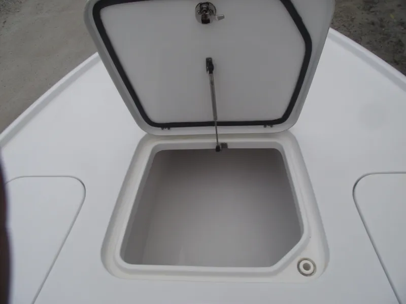 Slide: The Image of Open storage compartment on 2019 Sea Hunt BX 22 BR boat. - 14