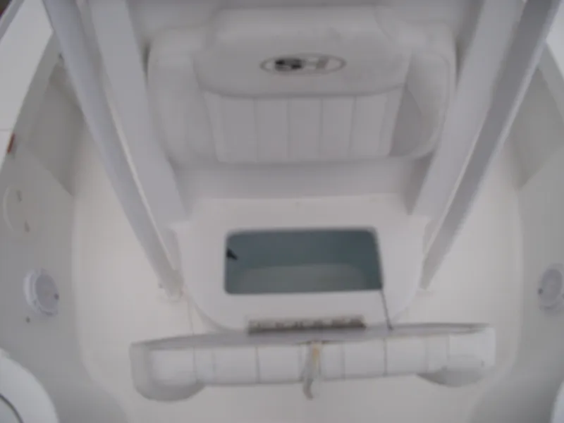 Slide: The Image of 2019 Sea Hunt BX 22 BR boat interior, featuring seating and storage compartments. - 16