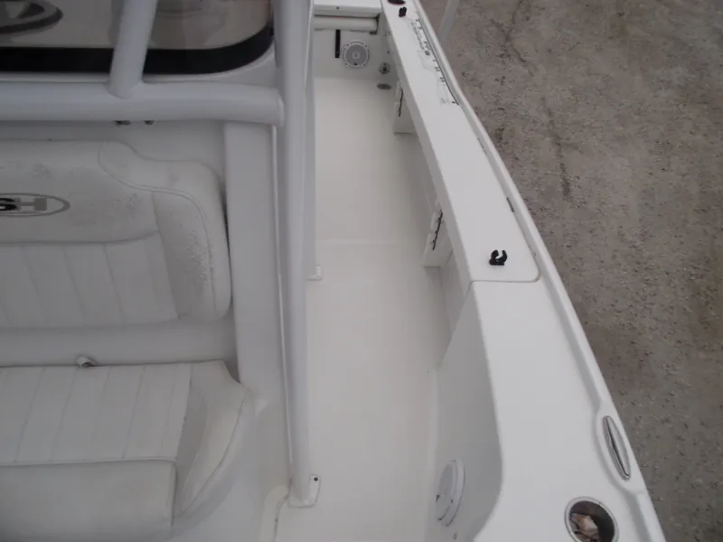 Slide: The Image of 2019 Sea Hunt BX 22 BR boat interior with white seating and deck. - 18