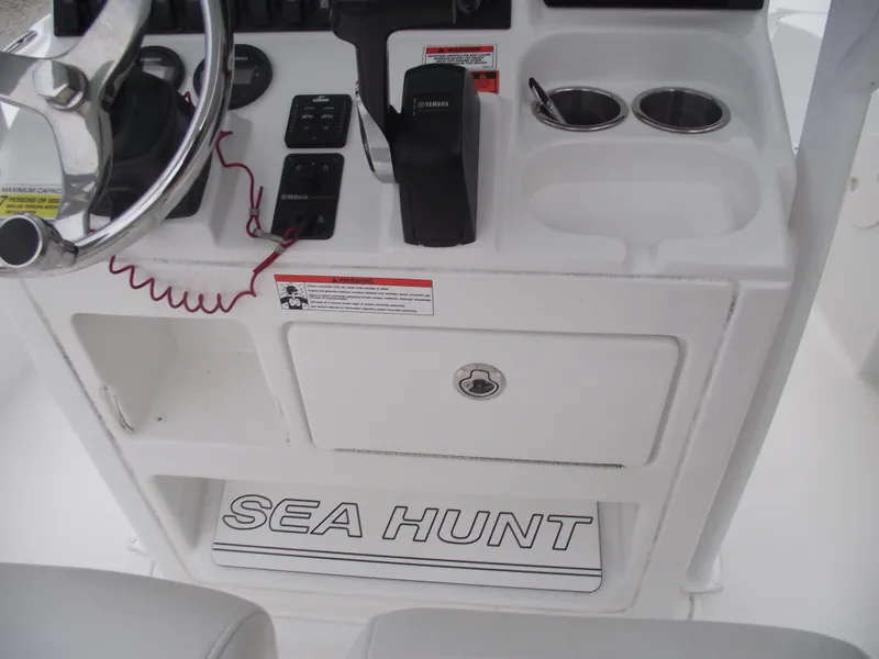 Slide: The Image of 2019 Sea Hunt BX 22 BR boat console with steering wheel and controls. - 22