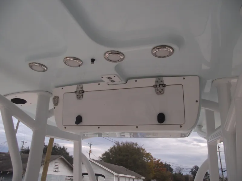 Slide: The Image of 2019 Sea Hunt BX 22 BR boat console with storage compartment and mounted lights. - 24