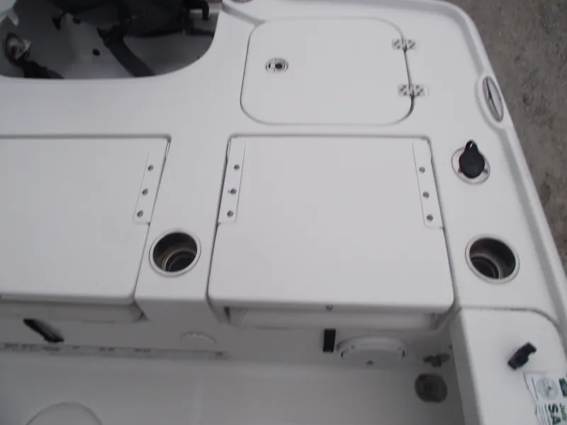 Slide: The Image of 2019 Sea Hunt BX 22 BR boat deck with storage compartments and cup holders. - 31