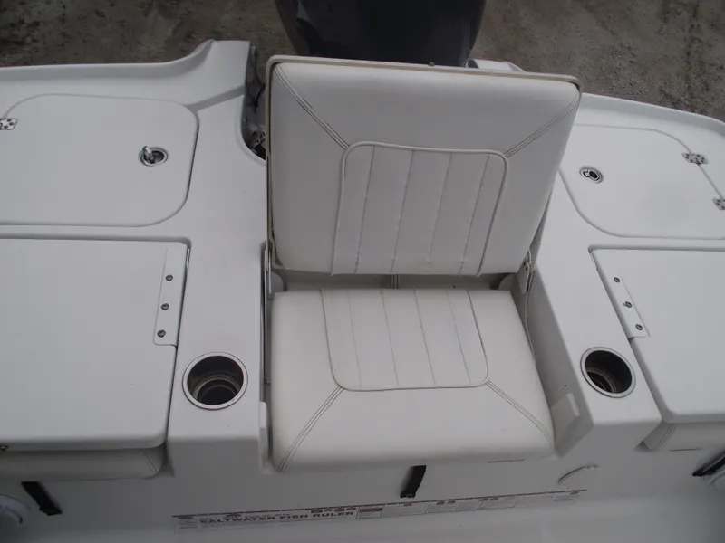 Slide: The Image of 2019 Sea Hunt BX 22 BR boat seat with white upholstery and cup holders. - 35