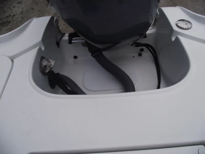 Slide: The Image of 2019 Sea Hunt BX 22 BR boat engine compartment, showing cables and connections. - 39