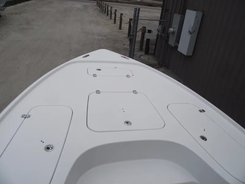 Slide: The Image of 2019 Sea Hunt BX 22 BR boat deck, white with storage compartments. - 6