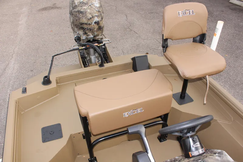 Slide: The Image of 2025 Excel 1860 F4 Shallow Water boat interior with seating and steering wheel. - 12