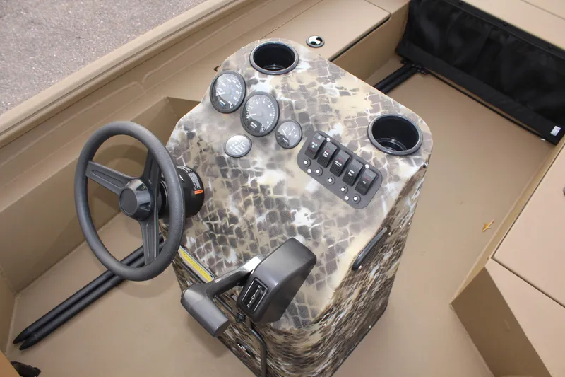 Slide: The Image of 2025 Excel 1860 F4 Shallow Water boat dashboard with steering wheel and control panel. - 14