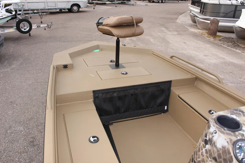 Slide: The Image of 2025 Excel 1860 F4 Shallow Water boat interior with seating and storage compartments. - 16