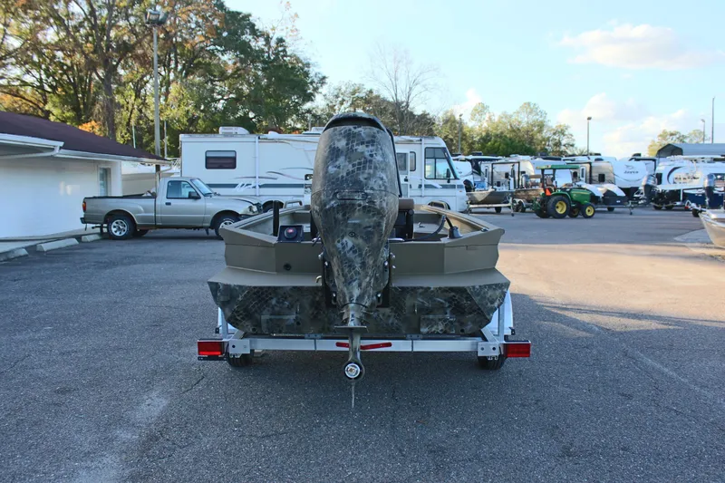 Slide: The Image of 2025 Excel 1860 F4 Shallow Water boat on trailer in parking lot. - 7