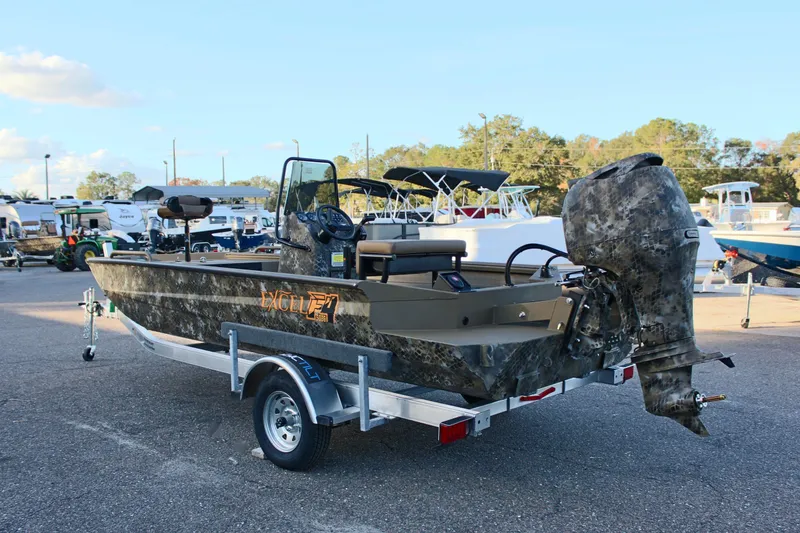 Slide: The Image of 2025 Excel 1860 F4 Shallow Water boat on trailer, camo design, outdoor display. - 8
