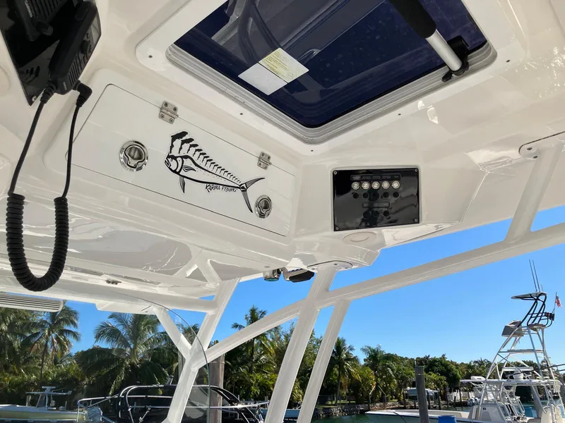 Slide: The Image of 2021 Sea Fox 328 Commander boat interior with fish decal and control panel. - 13