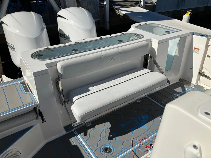 Slide: The Image of 2021 Sea Fox 328 Commander boat interior with seating and dual Yamaha engines. - 18