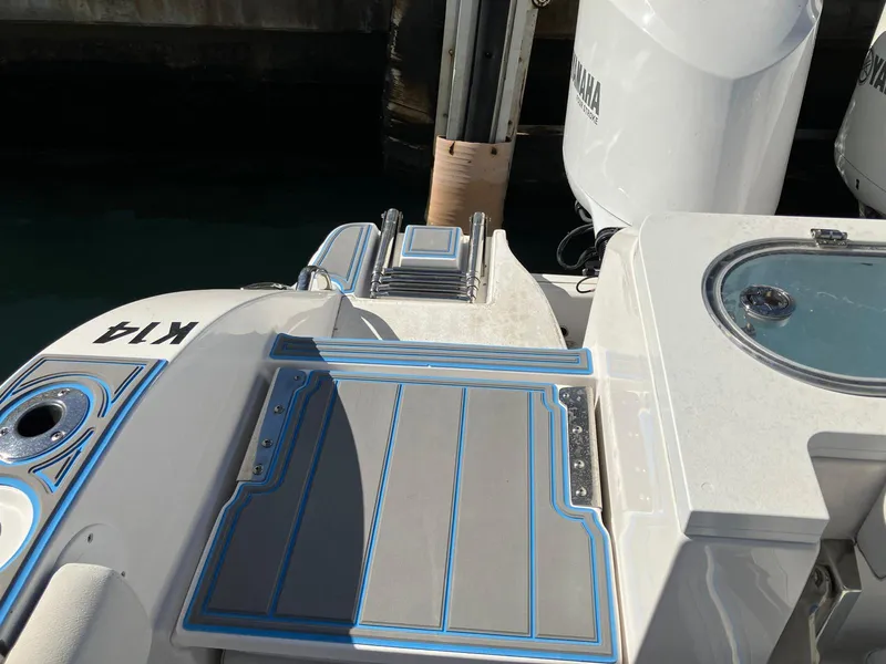 Slide: The Image of Sea Fox 328 Commander 2021 boat deck with Yamaha engine in marina. - 21