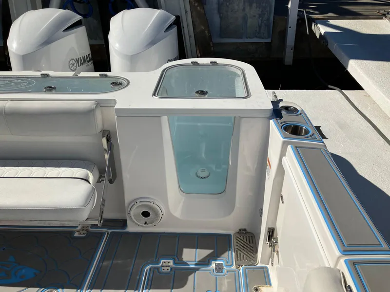 Slide: The Image of 2021 Sea Fox 328 Commander boat interior with seating and storage compartments. - 22