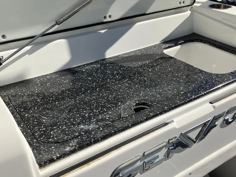 Slide: The Image of Sea Fox 328 Commander 2021 boat with sleek black speckled countertop and sink. - 23