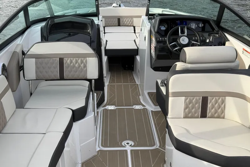 Slide: The Image of Luxurious interior of 2025 Monterey M6 boat with elegant seating and modern dashboard. - 15