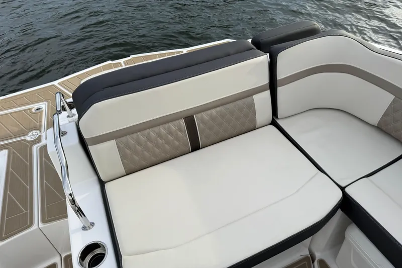 Slide: The Image of Luxurious seating on 2025 Monterey M6 boat with elegant design and water backdrop. - 21