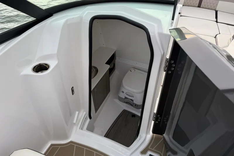 Slide: The Image of 2025 Monterey M6 boat interior with compact bathroom and modern amenities. - 24