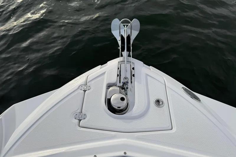 Slide: The Image of Bow of 2025 Monterey M6 boat with anchor, on calm water. - 8