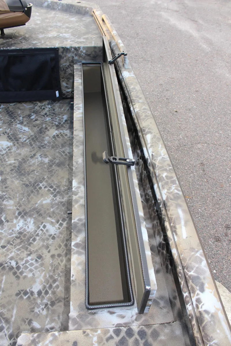 Slide: The Image of 2025 Excel 1860 F4 Shallow Water boat interior with camouflage design and storage compartment. - 17