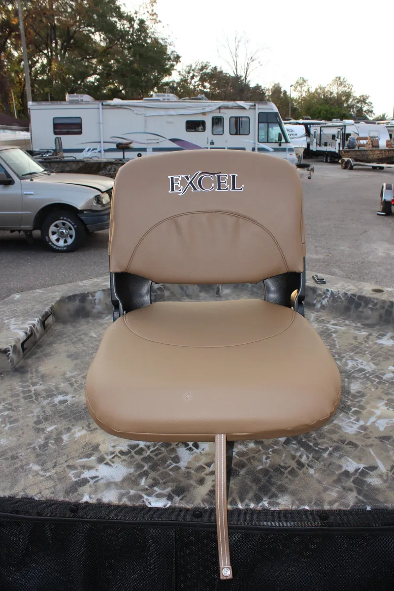 Slide: The Image of Excel 1860 F4 Shallow Water boat seat, 2025 model, in outdoor setting. - 18