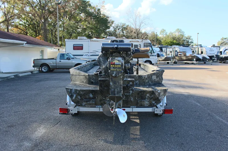 Slide: The Image of 2025 Excel 1860 F4 Shallow Water boat on trailer in parking lot. - 6