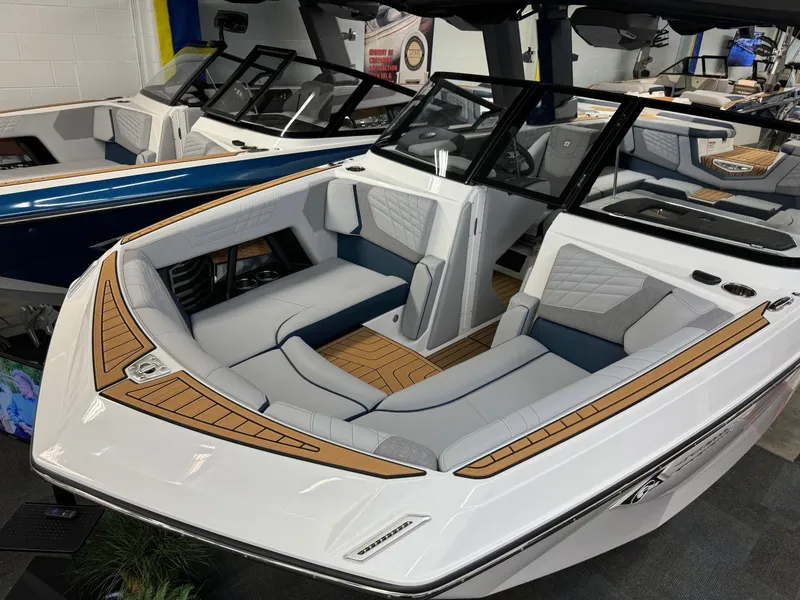 Slide: The Image of 2024 Nautique Super Air Nautique G23 boat with sleek design and luxurious seating. - 10