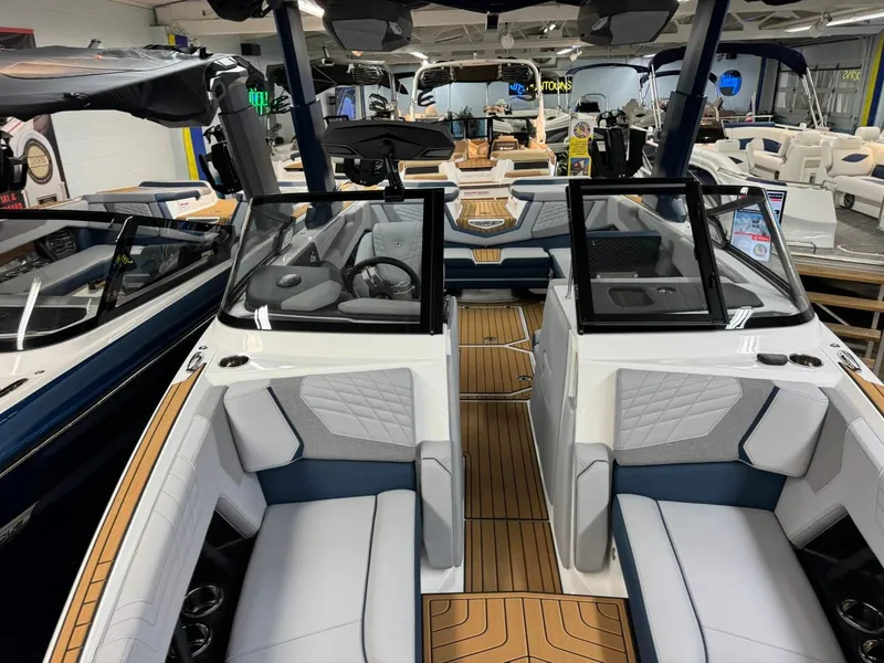 Slide: The Image of 2024 Nautique Super Air Nautique G23 interior with luxurious seating and modern design. - 16