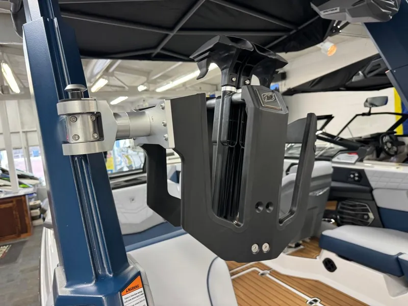 Slide: The Image of 2024 Nautique Super Air Nautique G23 wakeboard rack detail in a luxury boat interior. - 19
