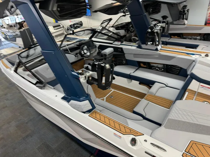 Slide: The Image of 2024 Nautique Super Air Nautique G23 boat interior with modern design and seating. - 23