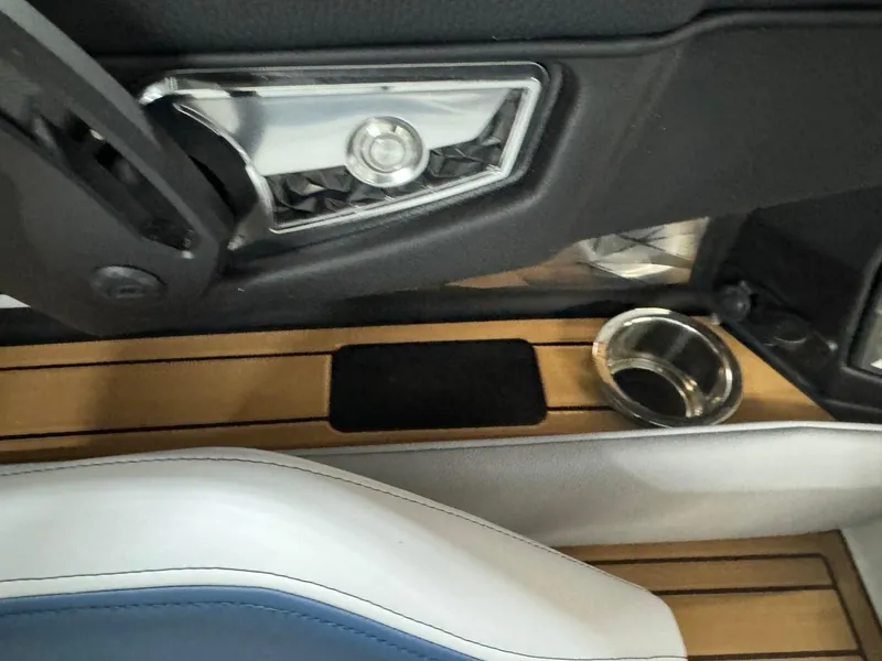 Slide: The Image of 2024 Nautique Super Air Nautique G23 interior detail with speaker and cup holder. - 37