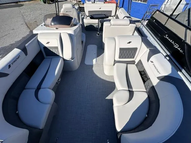 Slide: The Image of 2025 Starcraft CX 23 DL BAR pontoon boat interior with luxurious seating and modern design. - 2