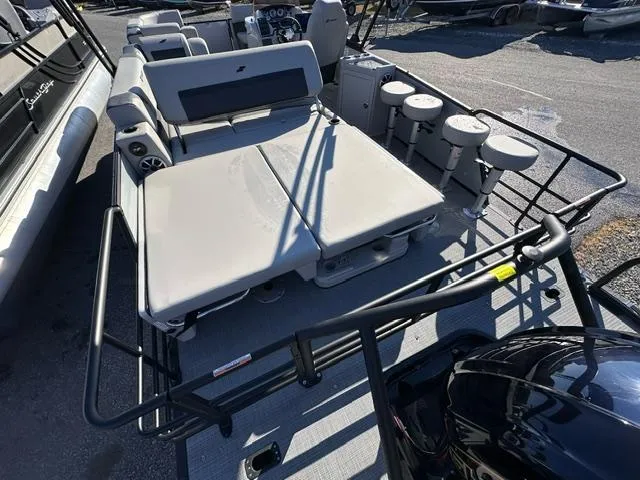 Slide: The Image of 2025 Starcraft CX 23 DL BAR pontoon boat with spacious seating and modern design. - 7