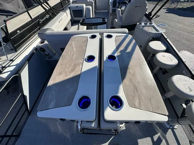 Slide: The Image of 2025 Starcraft CX 23 DL BAR boat interior with modern seating and cup holders. - 8