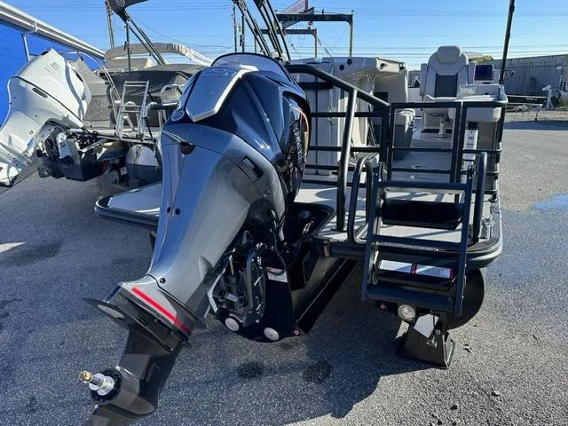 Slide: The Image of 2025 Starcraft CX 23 DL BAR pontoon boat with powerful outboard motor. - 9