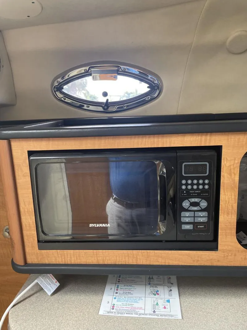 Slide: The Image of Microwave in 2006 Sea Ray 270 Amberjack cabin interior. - 12