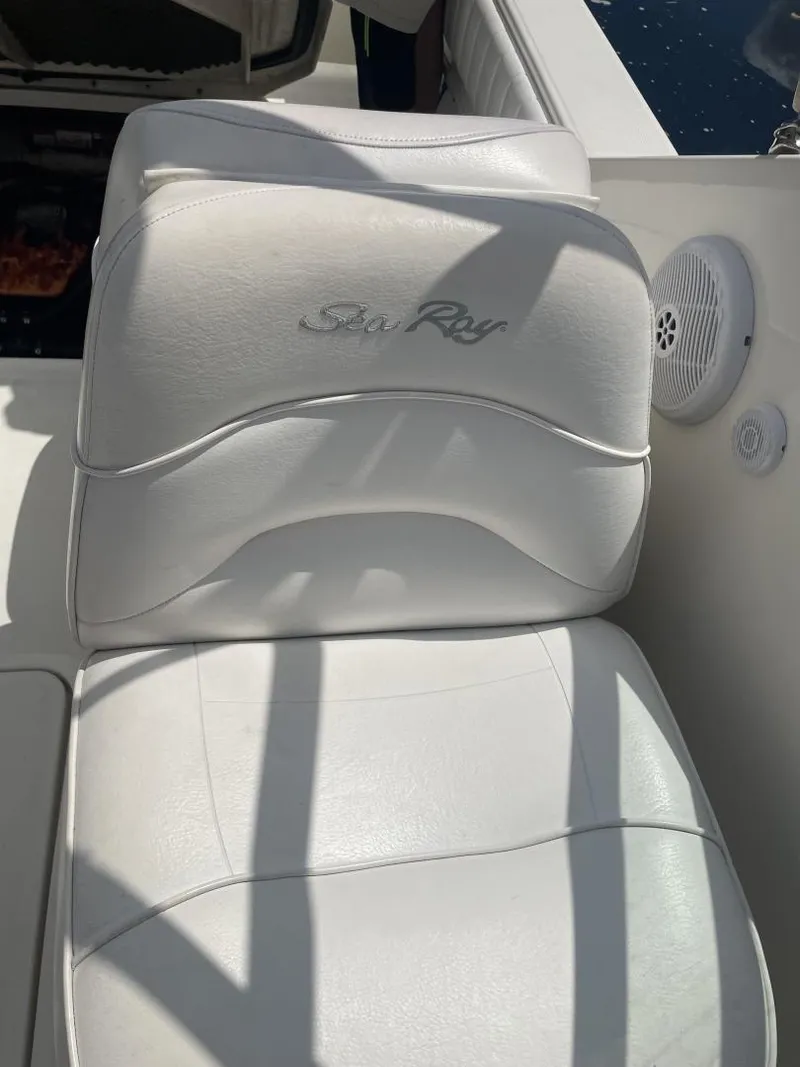 Slide: The Image of White leather seat on 2006 Sea Ray 270 Amberjack boat, featuring logo and speaker. - 27