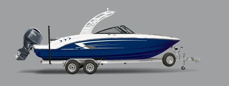 The Image of 2025 Chaparral 21 SSi OB boat on trailer, blue and white design. - 0
