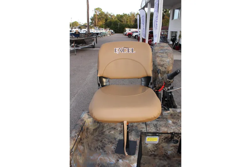 Slide: The Image of Tan seat on Excel 1751 Viper F4 boat, 2025 model, in outdoor setting. - 10