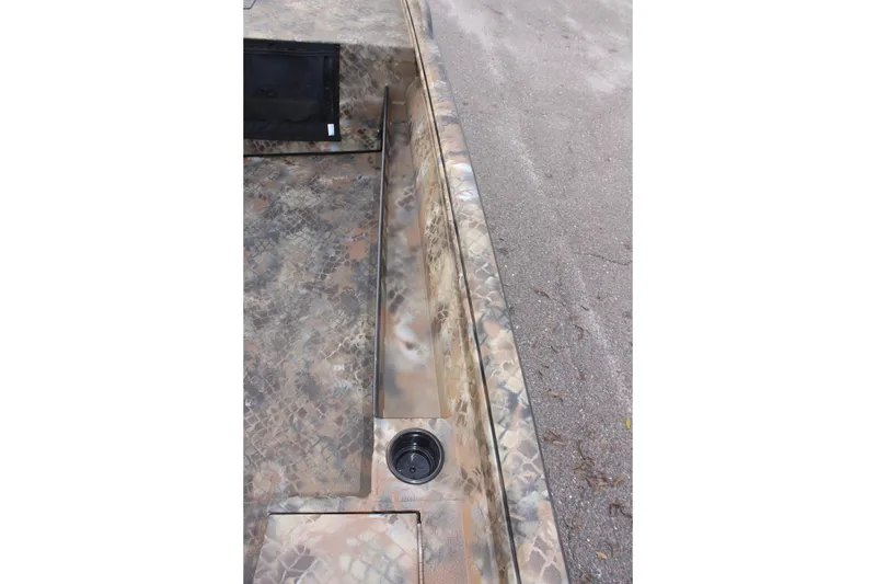 Slide: The Image of Camouflage-patterned interior of 2025 Excel 1751 Viper F4 boat, featuring a cup holder. - 16