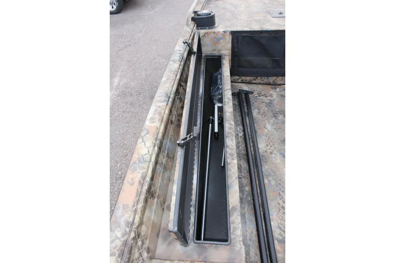 Slide: The Image of 2025 Excel 1751 Viper F4 boat interior with storage compartment open. - 17