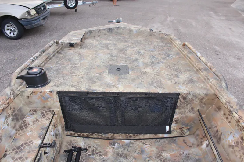 Slide: The Image of Camouflage-patterned deck of 2025 Excel 1751 Viper F4 boat, parked on pavement. - 18