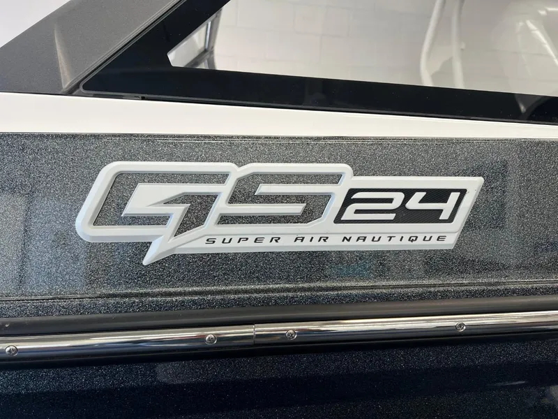 Slide: The Image of 2024 Nautique Super Air Nautique GS24 logo on boat exterior. - 10